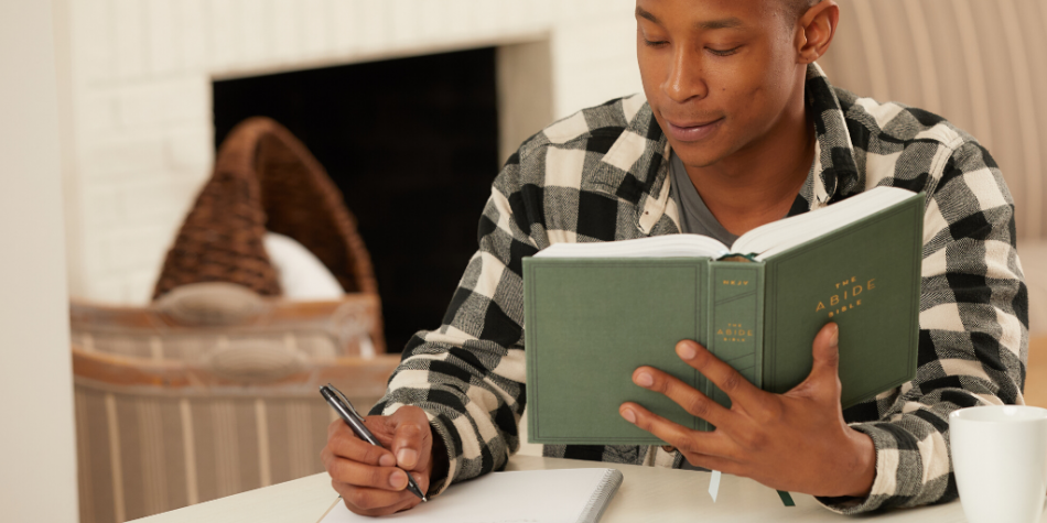 Man journaling scripture