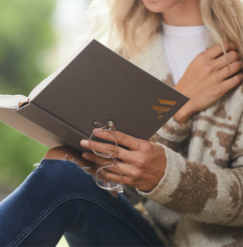 woman reading the Ancient Modern Bible