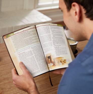 Man reading the NKJV The Chronological Study Bible