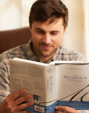 man reading NASB MacArthur Study Bible