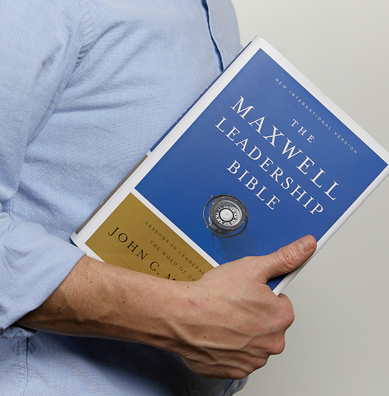 man holding NIV Maxwell Leadership Bible