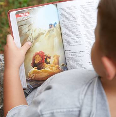 boy reading the ICB Children's Holy Bible