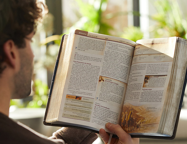 man reading the Chronological Study Bible