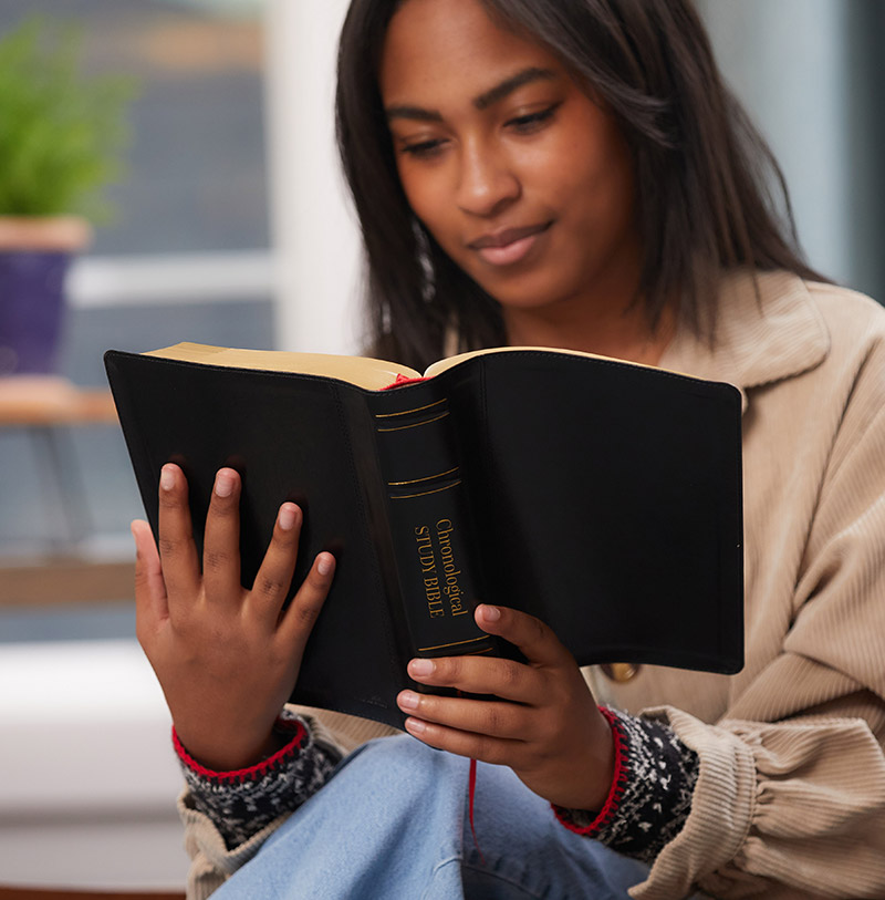 woman reading Chronological Bible