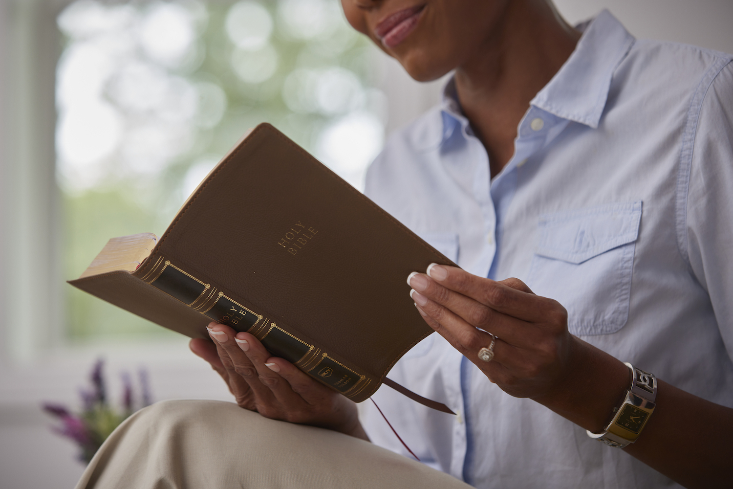 A woman reading a Bible